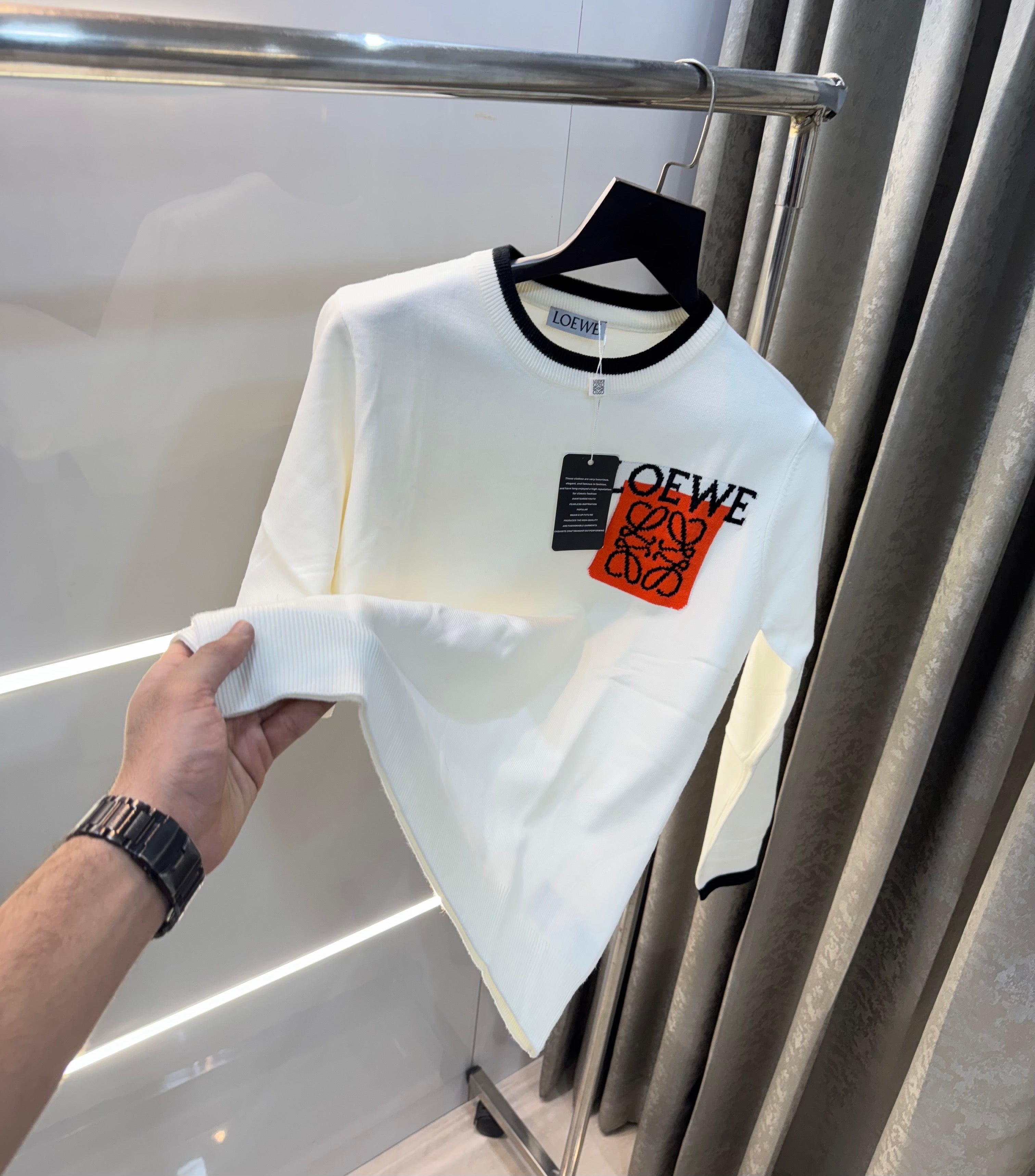 lo...ewe White Imported Knitted Pull Over Main image