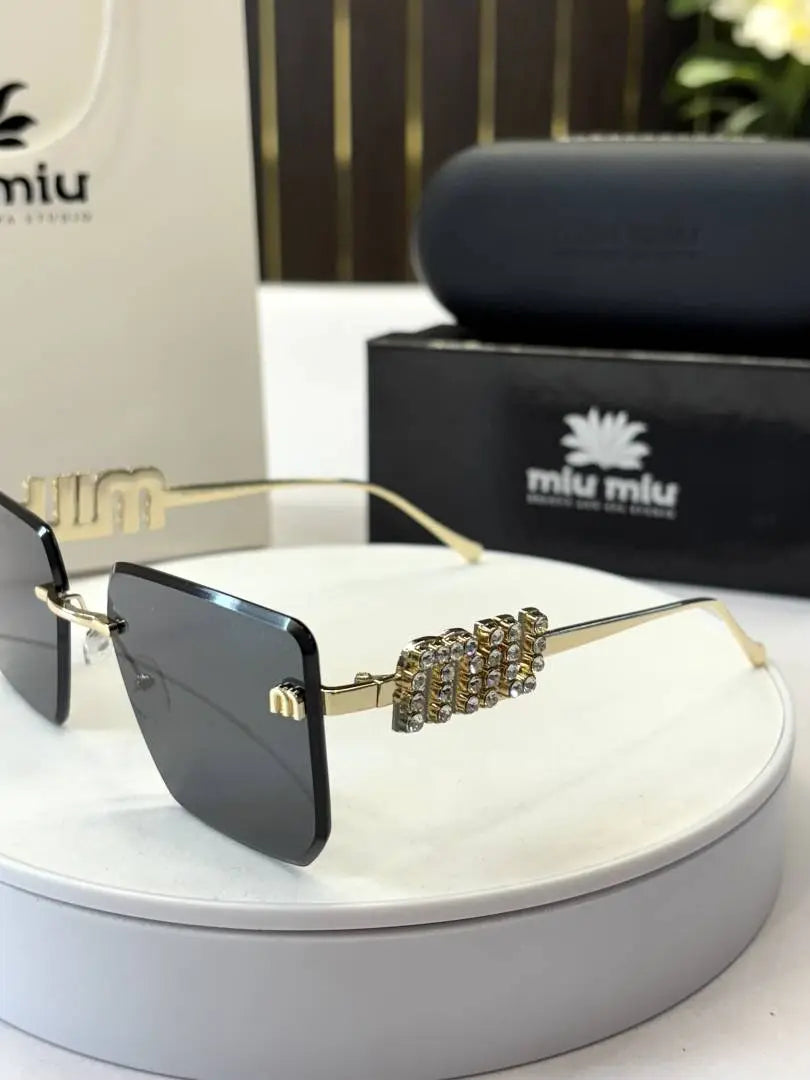 _Miu_miu_1024_frameless_blk_gold Secondary image