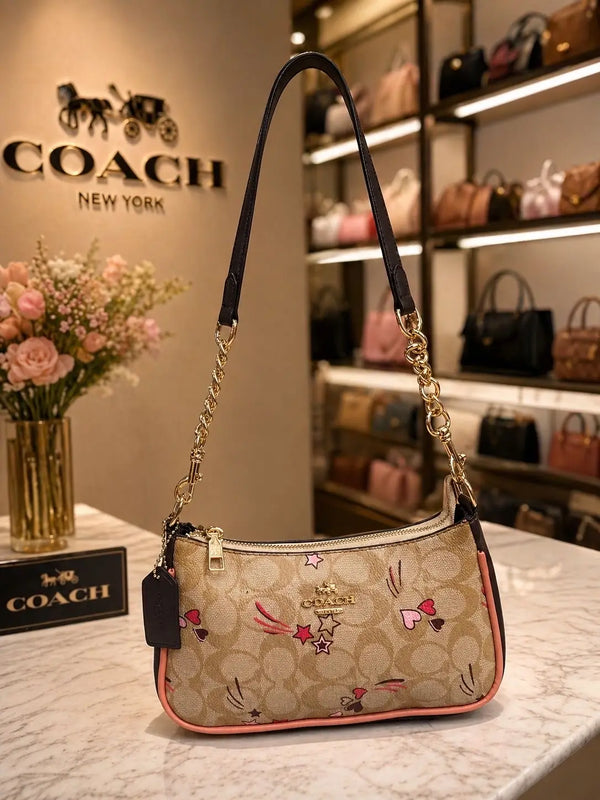 Coach Outlet Teri Shoulder Bag in Signature Canvas with Heart and Star Print with dust bag