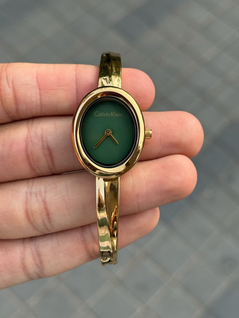 Calvin Klei n Oval Twisted Bezel Women Gold Green
