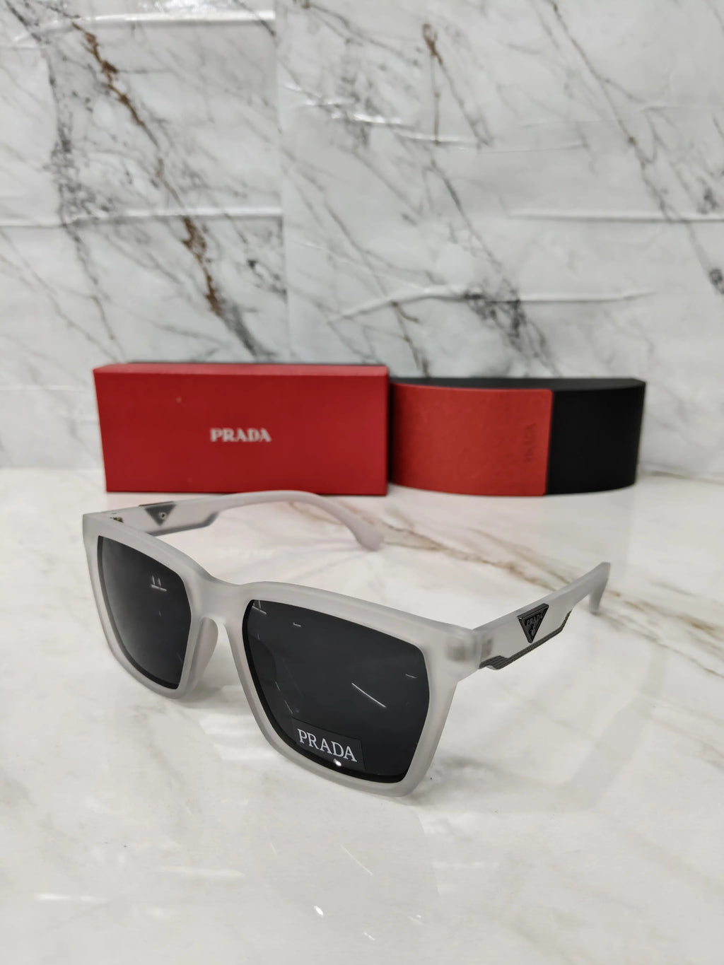 PRADA 0626 TRANSPARENT GREY METAL LOGO