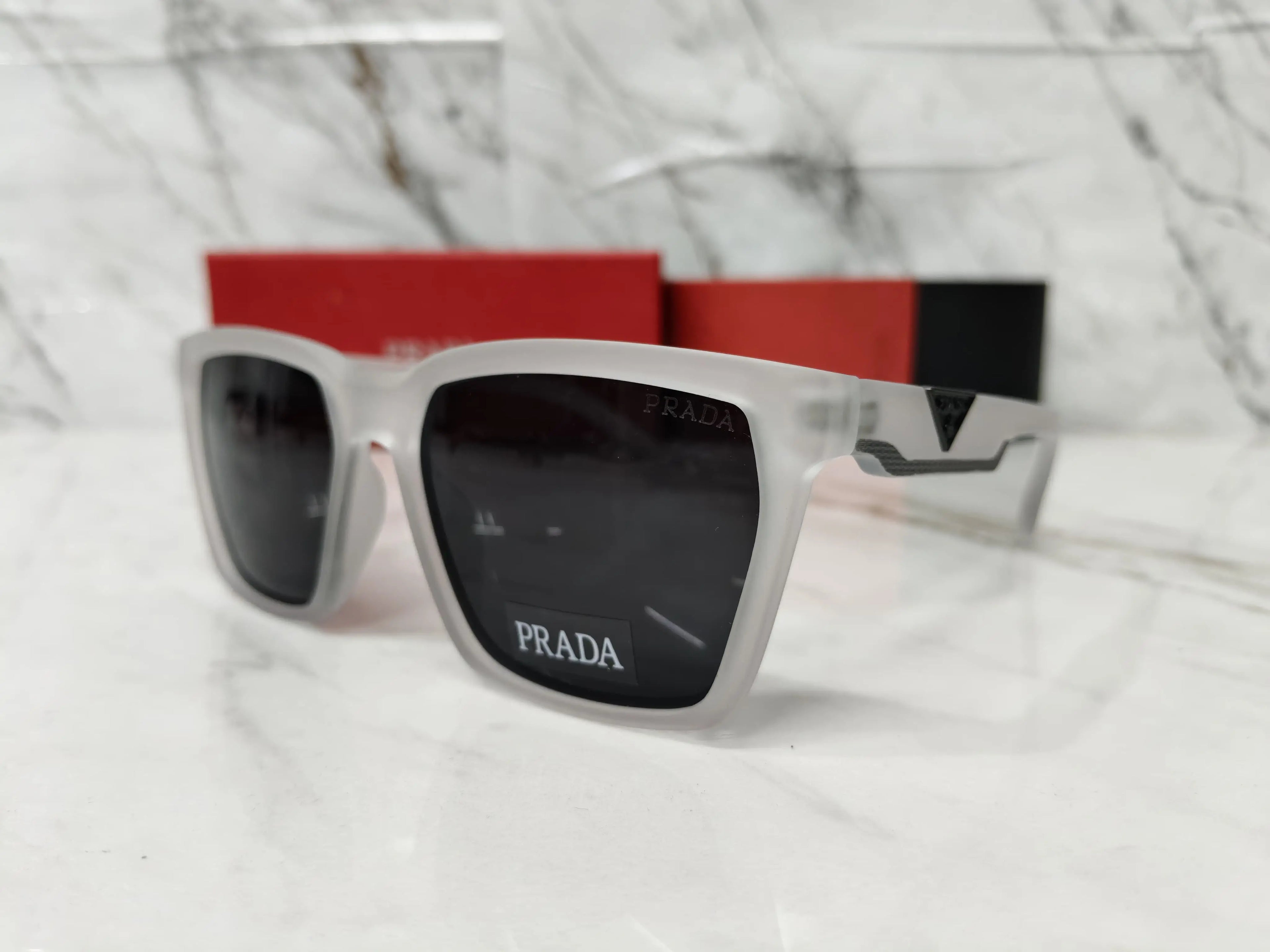 PRADA 0626 TRANSPARENT GREY METAL LOGO